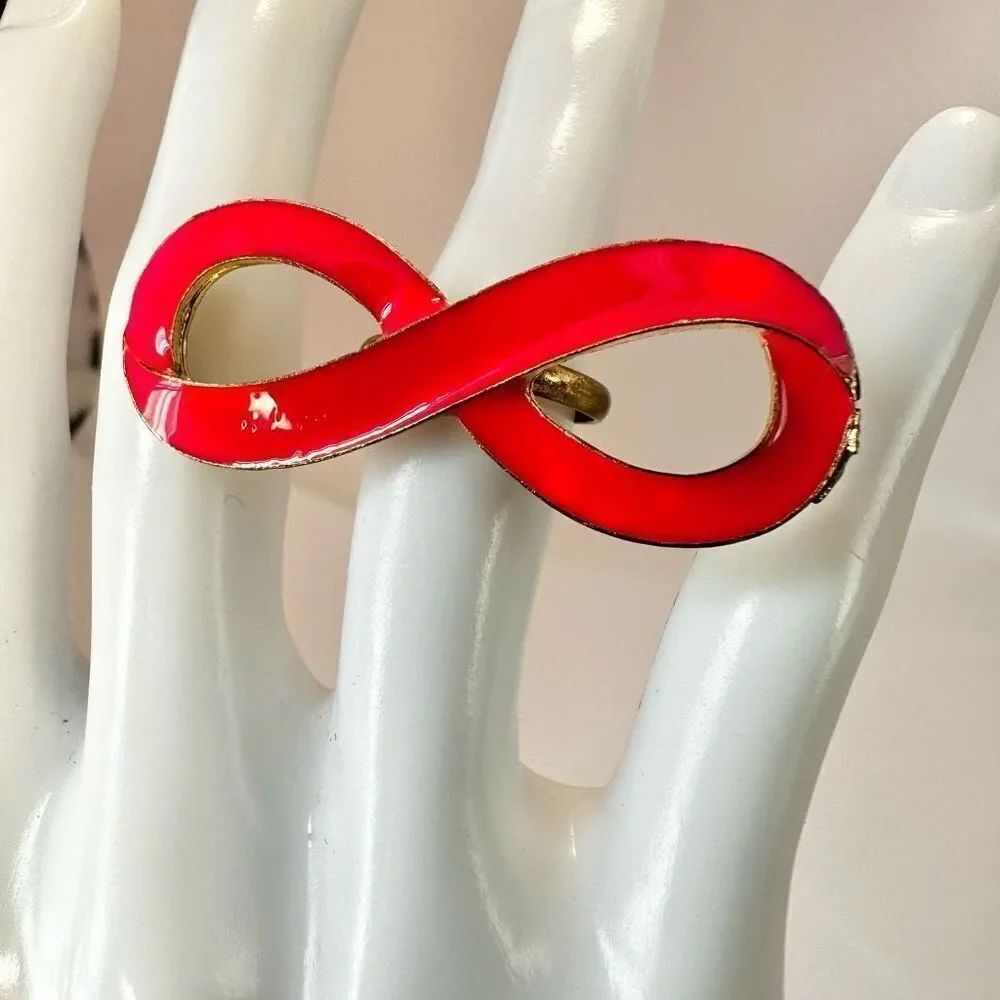 Pink and gold tone infinity ring